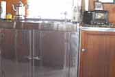 Picture of kitchen woodwork and stainless steel counters in 1947 Aero Flite Trailer